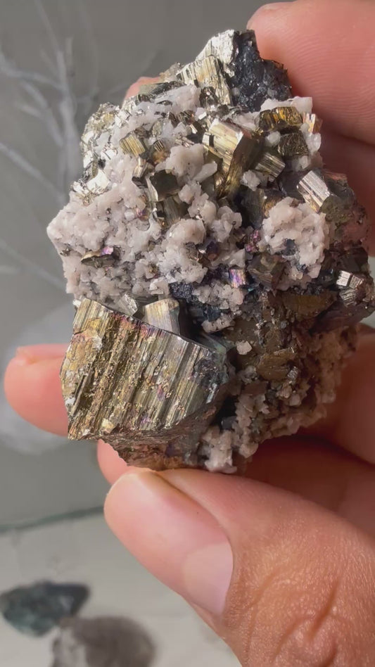 Iridescent pyrite with calcite